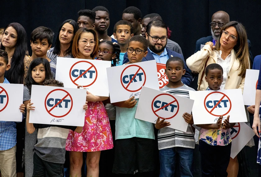 Students at Mater Academy Charter Middle/High School hold signs protesting against “critical race theory” being taught in schools on April 22, 2022, in Hialeah Gardens, Fla. Photo courtesy of Daniel A. Varela/Miami Herald via AP.