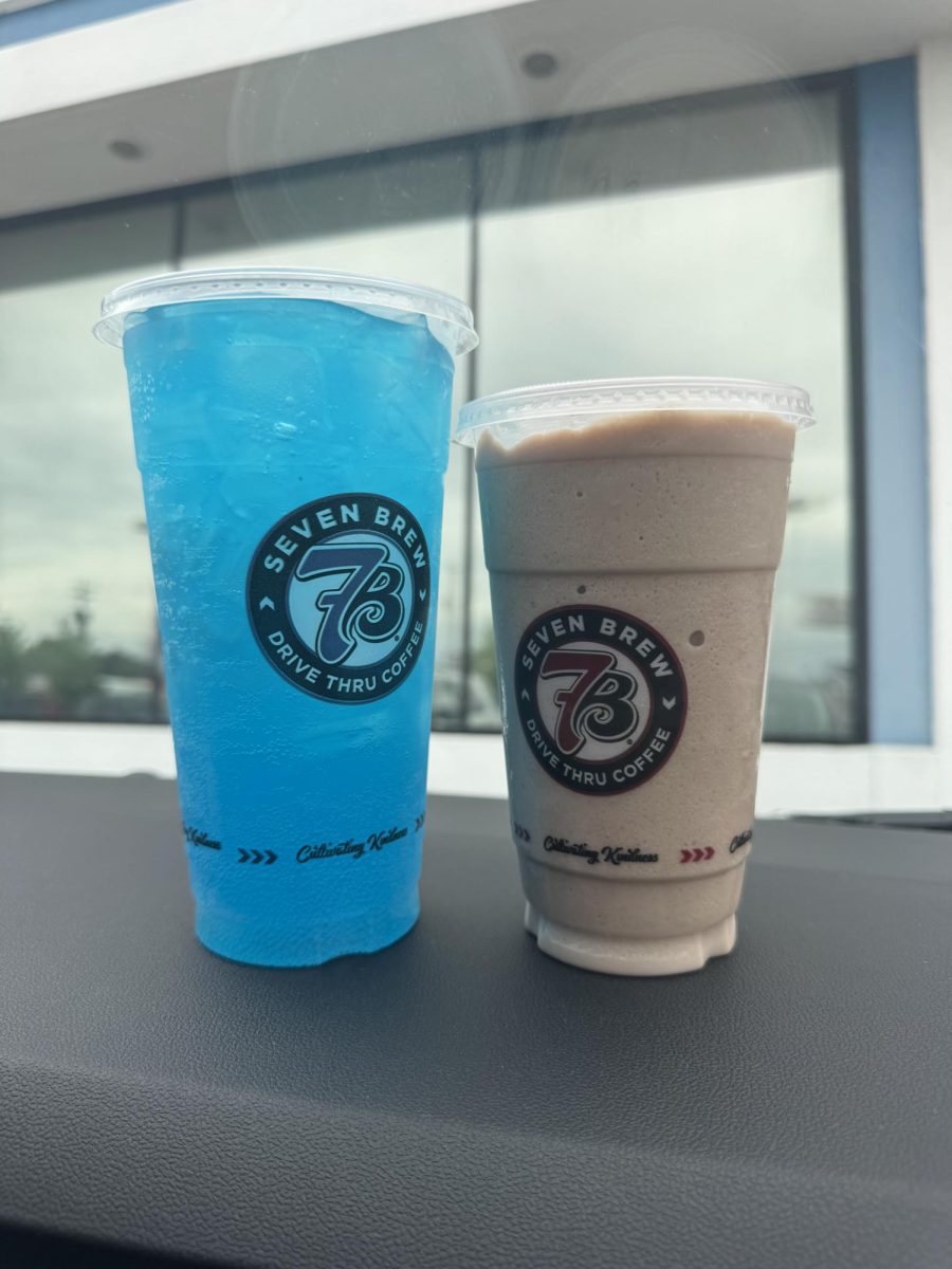 The 7 Brew blue lagoon drink (left) and the cookies and cream milkshake (right) in the 7 Brew parking lot. On May 4 of this year, the newest 7 Brew Location opened in Roseville, Michigan. Photo courtesy of: Millie Vollmer