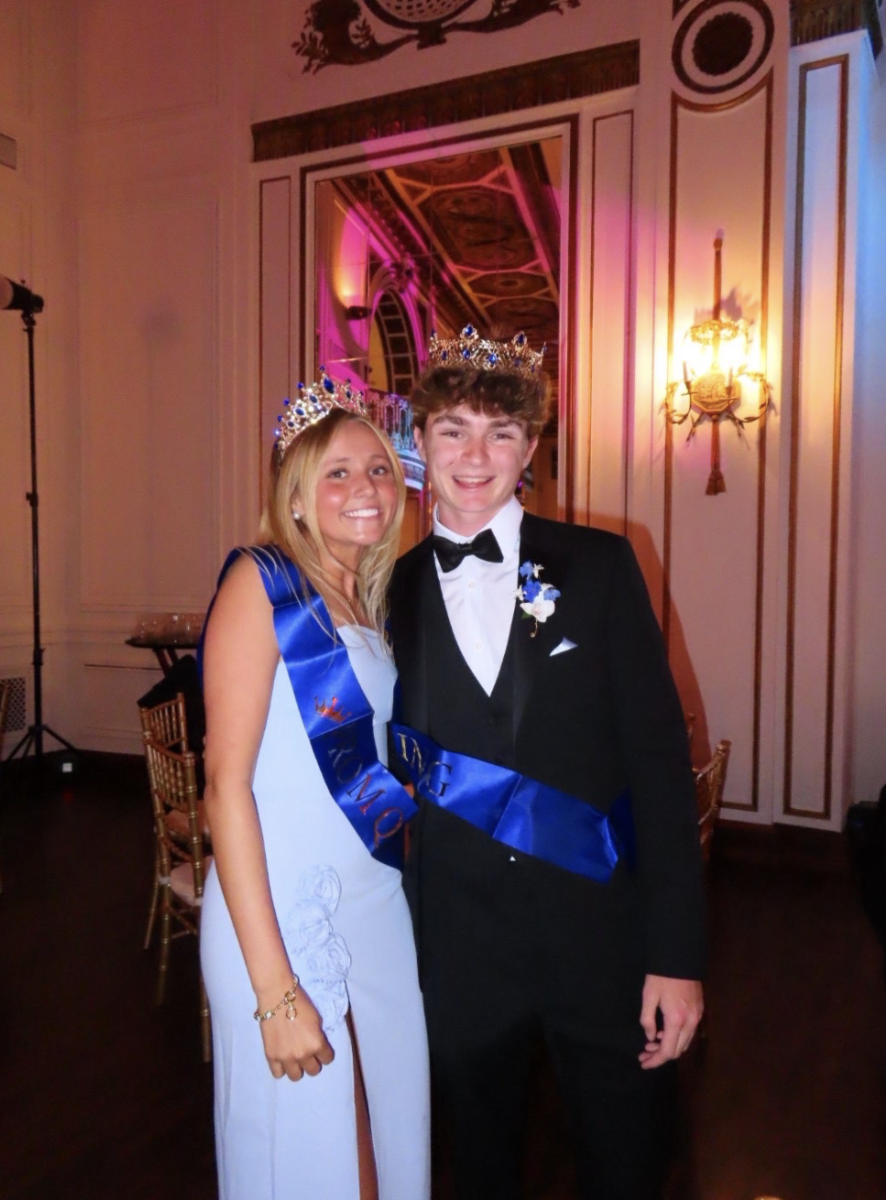  Welcoming the honor: Seniors Lotty Gates and Jackson Montague celebrate with smiles after getting announced as prom king and queen. Gates missed the initial announcement, which left Montague having to accept the award alone until she returned to the main dining room. 
Photo courtesy of Lotty Gates 
